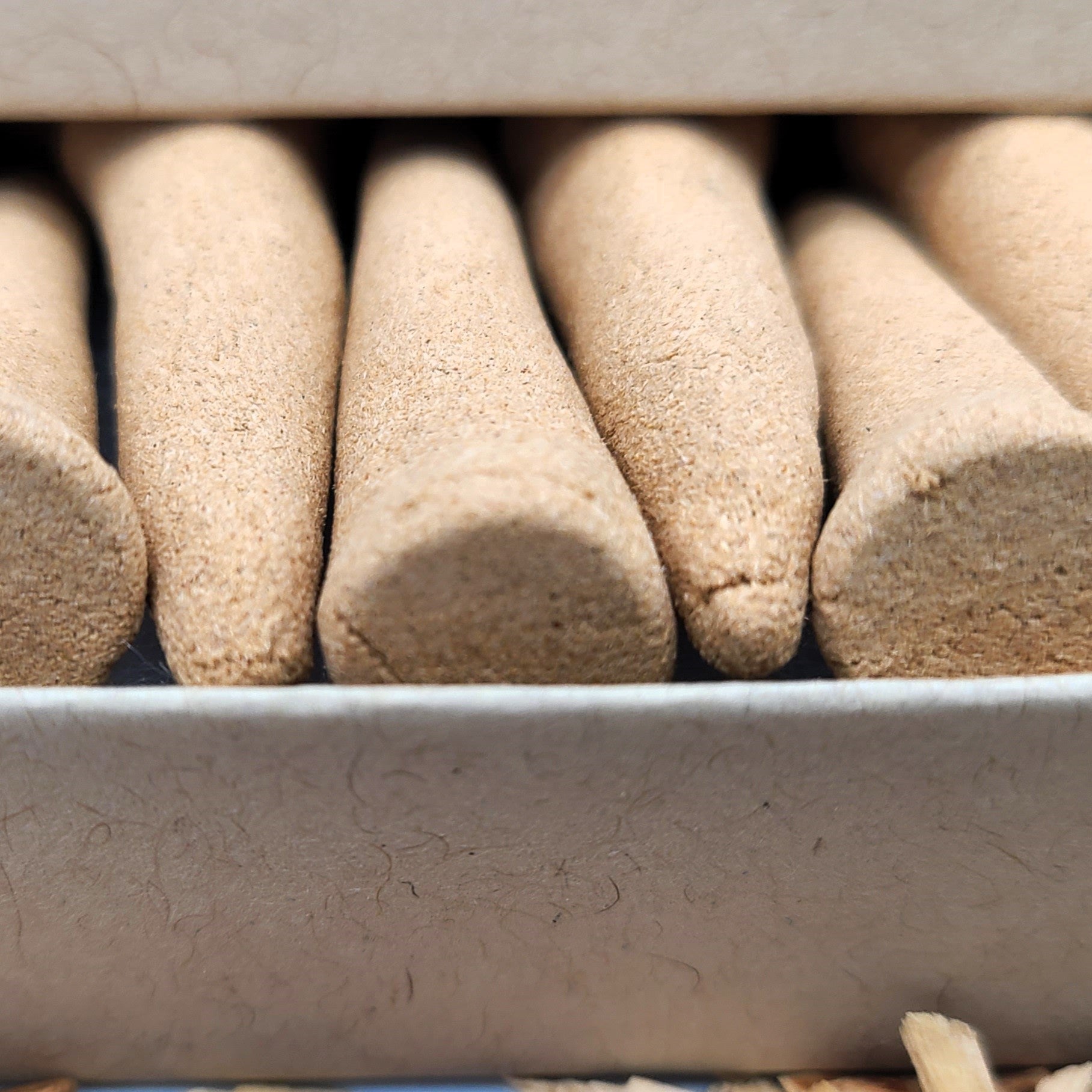 Close up detailed photo of Australian Sandalwood organic incense cones.