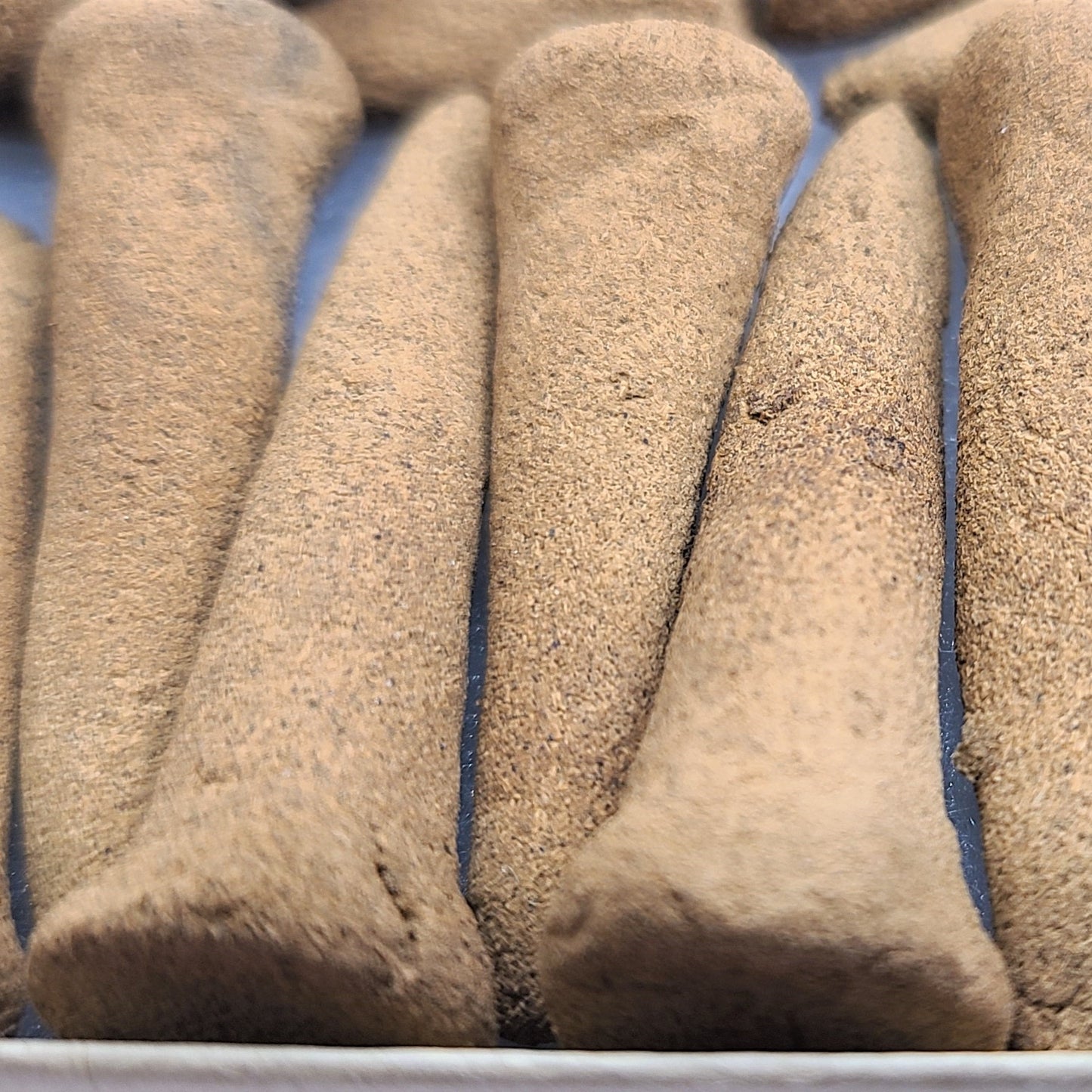 Close up detailed photo of White Sage organic incense cones.