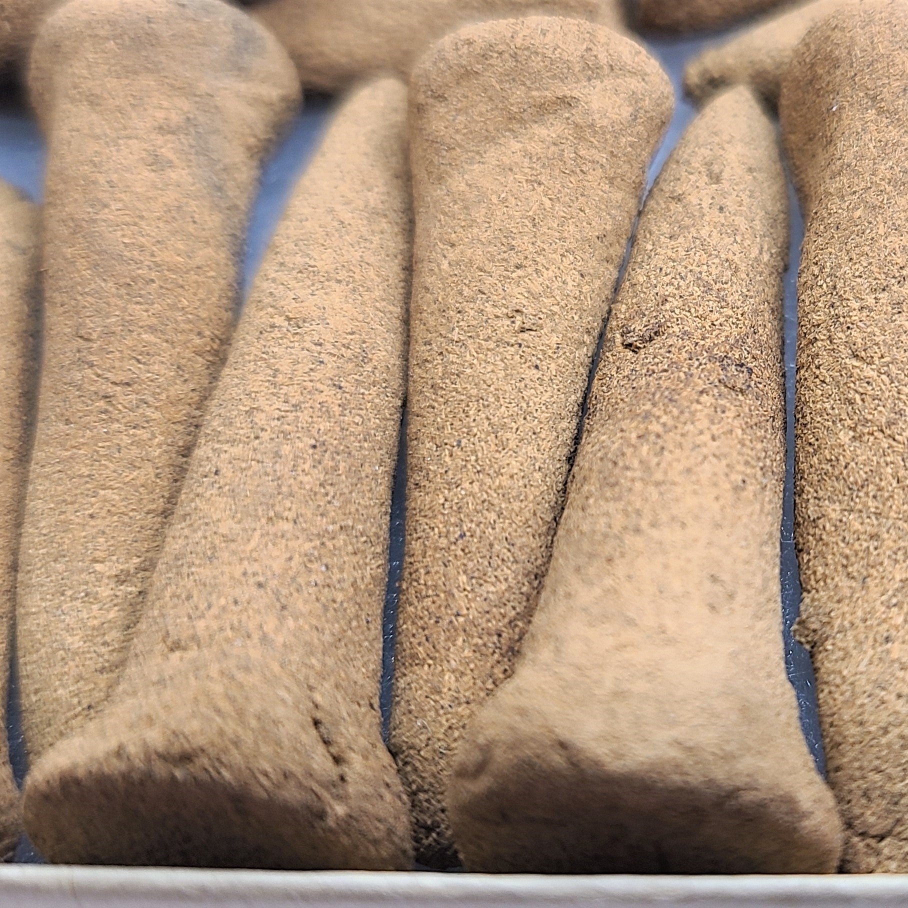 Close up detailed photo of White Sage organic incense cones.