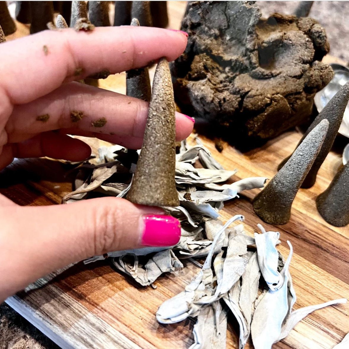 White Sage cone in the process of being made by hand.