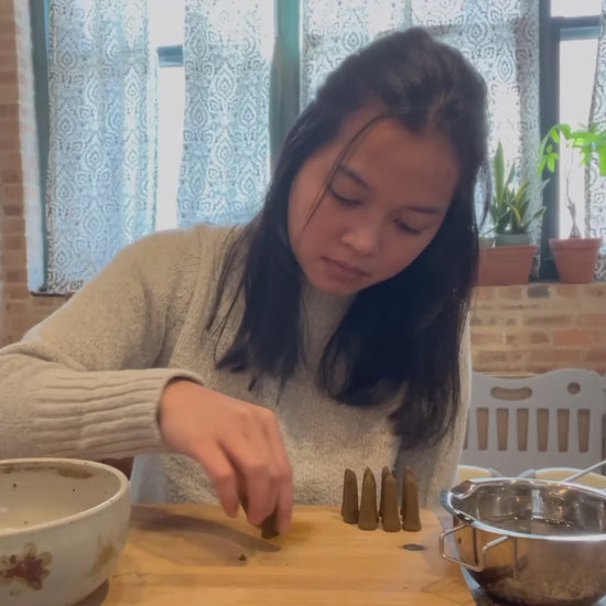 Making organic incense by hand.